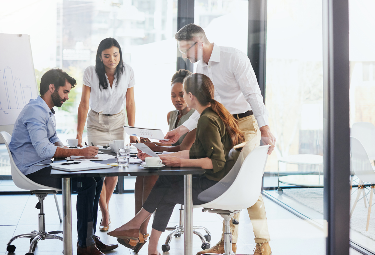 Group of diverse professionals in an office meeting.