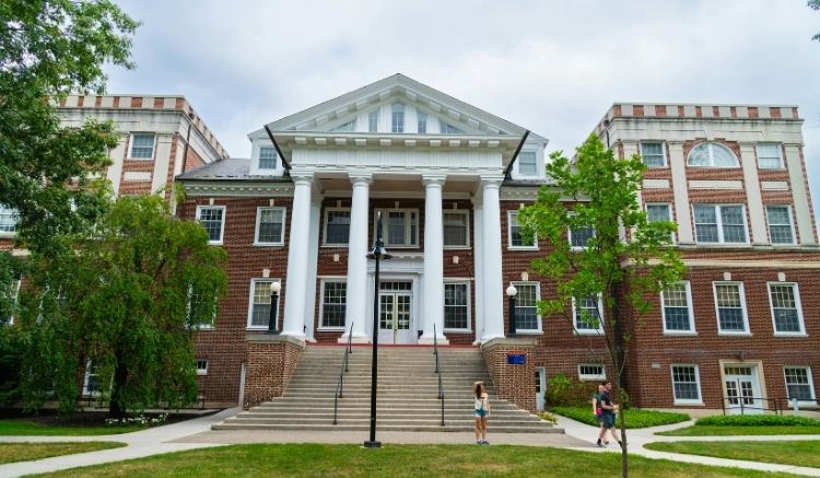a brick building with large white columns