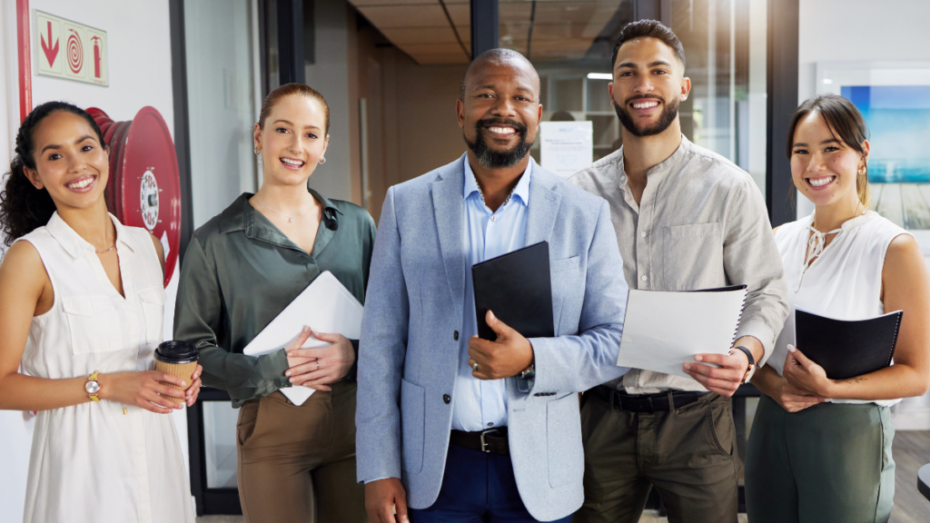 Group of professionals smiling at camera