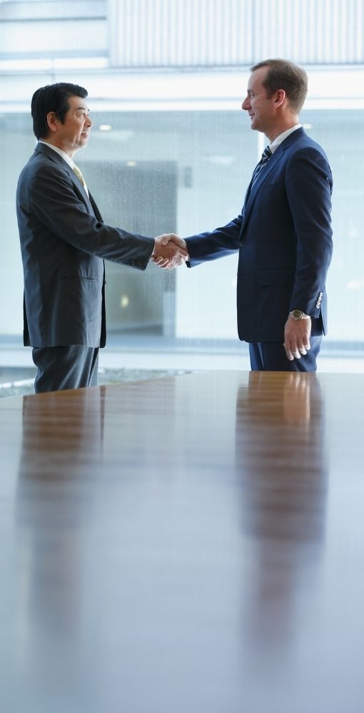 2 professional people shaking hands.